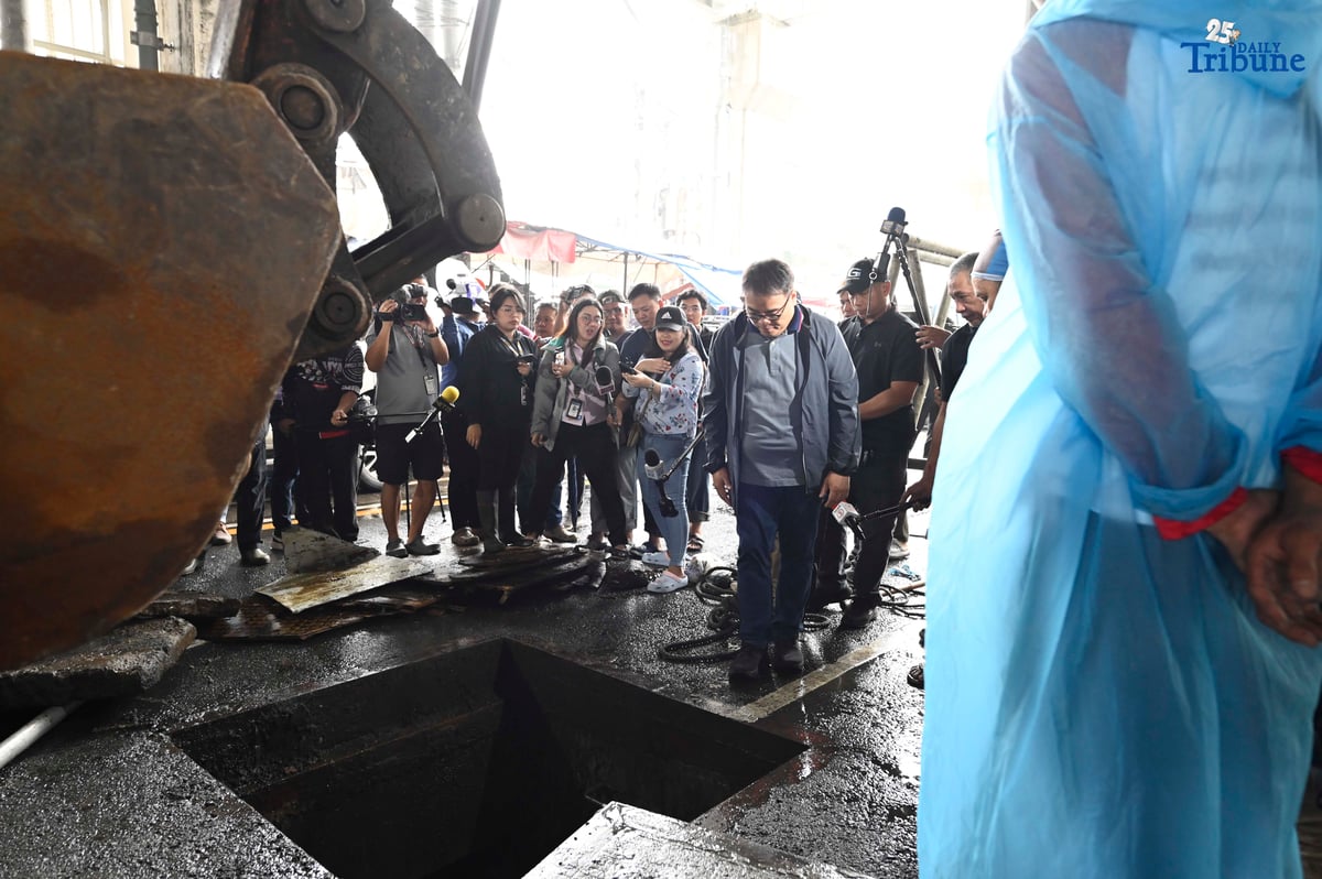MMDA Chairman Atty. Don Artes inspects a manhole and oversees the clearing of garbage that contributed to flooding near MRT-7 Batasan Station along Commonwealth Avenue in Quezon City on Wednesday, July 23, 2025.