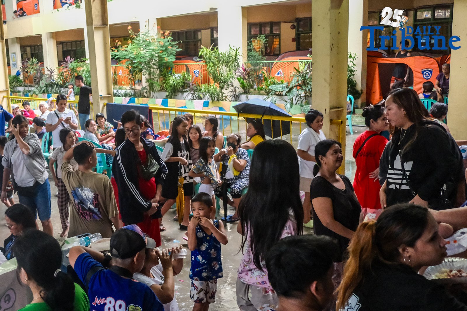 Nearly 989 families, or about 3,732 individuals, are currently sheltering at Diosdado Macapagal Elementary School in Barangay Tatalon, Quezon City, as Typhoon Crising continues to batter Metro Manila with heavy rains and gusty winds. The intensified southwest monsoon has triggered widespread flooding, leading to the declaration of a state of calamity in the city. Evacuees face cramped, damp conditions and health concerns, while local government units rush to deliver food, water, and hygiene kits. PAGASA has warned of ongoing rain, thunderstorms, flash floods, and landslides as Crising slowly moves across Northern Luzon.