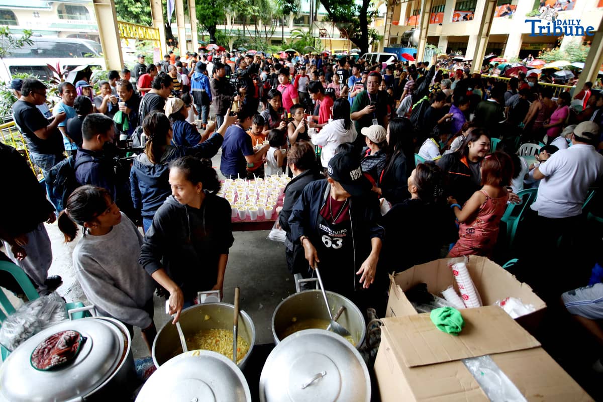 Residents affected by flooding take shelter at Diosdado P. Macapagal Elementary School in Barangay Tatalon, Quezon City. Senator Erwin Tulfo, in partnership with World Vision, led a relief and feeding program for evacuees on Wednesday, July 23, 2025.