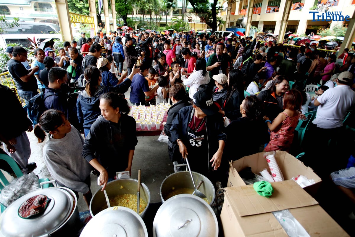 Residents affected by flooding take shelter at Diosdado P. Macapagal Elementary School in Barangay Tatalon, Quezon City. Senator Erwin Tulfo, in partnership with World Vision, led a relief and feeding program for evacuees on Wednesday, July 23, 2025.