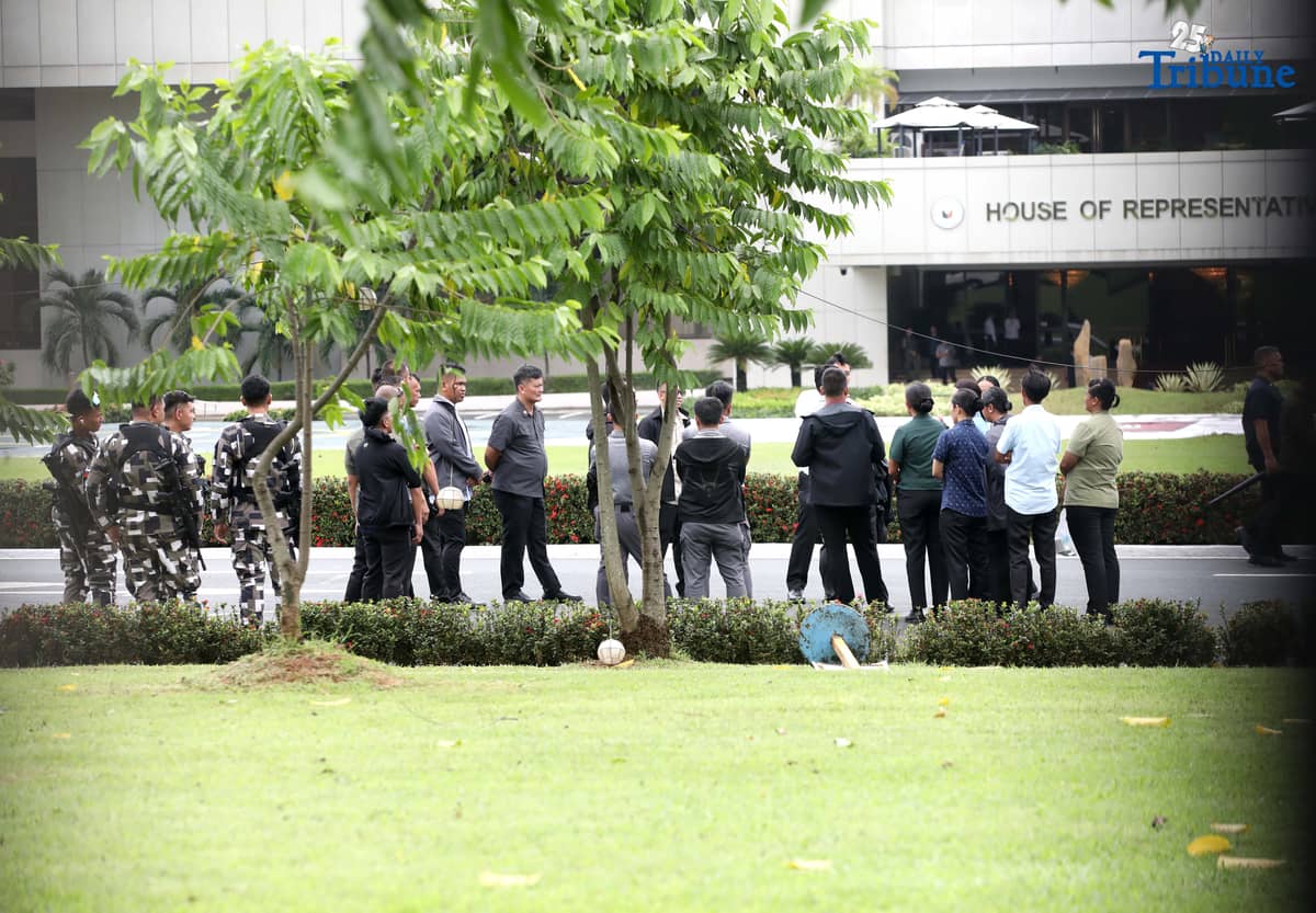 Members of the Malacañang Presidential Security Group (PSG) conduct a walkthrough outside the House of Representatives in Quezon City on Saturday, July 26, 2025, as part of the security preparations for President Ferdinand Marcos Jr.'s 4th State of the Nation Address.