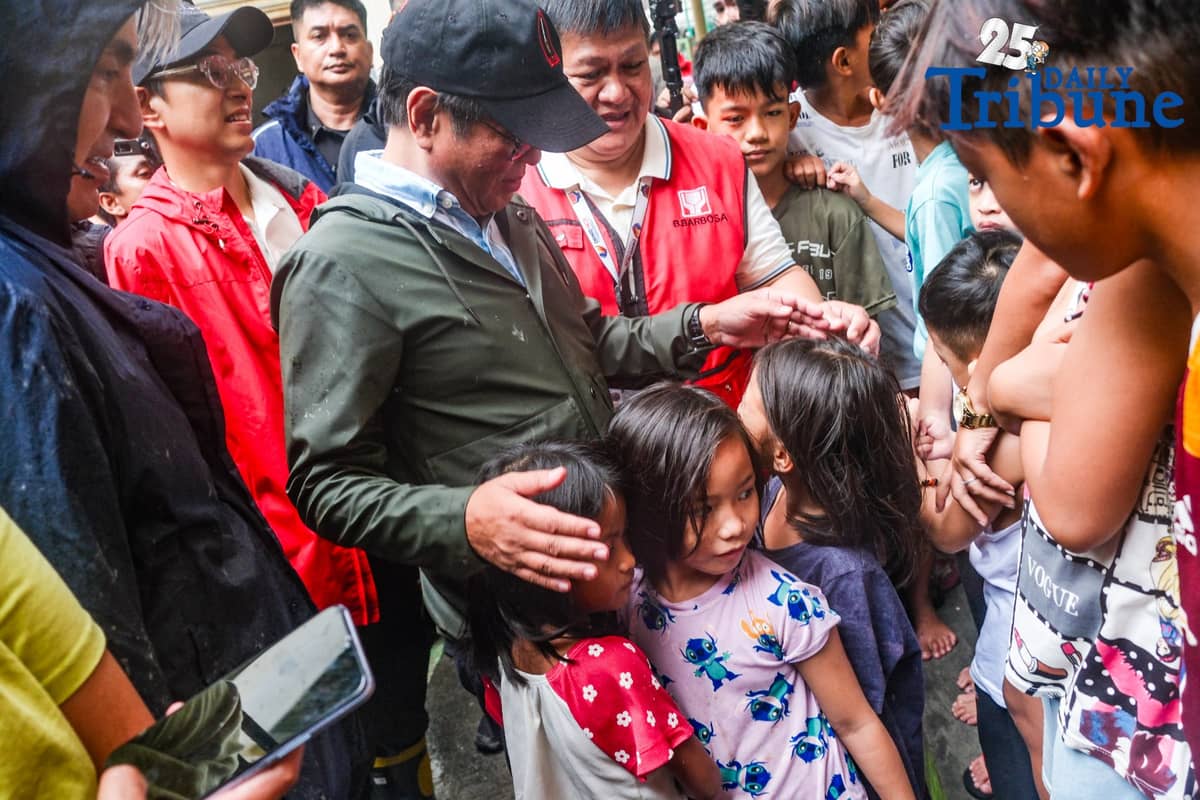 President Ferdinand Marcos Jr. visited Tanza National High School on Saturday morning, where evacuees from Navotas are temporarily sheltered, following his inspection of the Tangos-Tanza Navigational Gate. Due to inclement weather, his planned visit to Bacolor, Pampanga was canceled. In Tanza, residents and children greeted the President warmly, with some embracing him during their brief exchanges. Meanwhile, his administration faces mounting criticism over the transparency and effectiveness of ongoing flood control efforts. As typhoons remain a persistent threat, all eyes are on how his administration will address disaster preparedness and implement long-delayed infrastructure reforms in the remaining years of his term.
