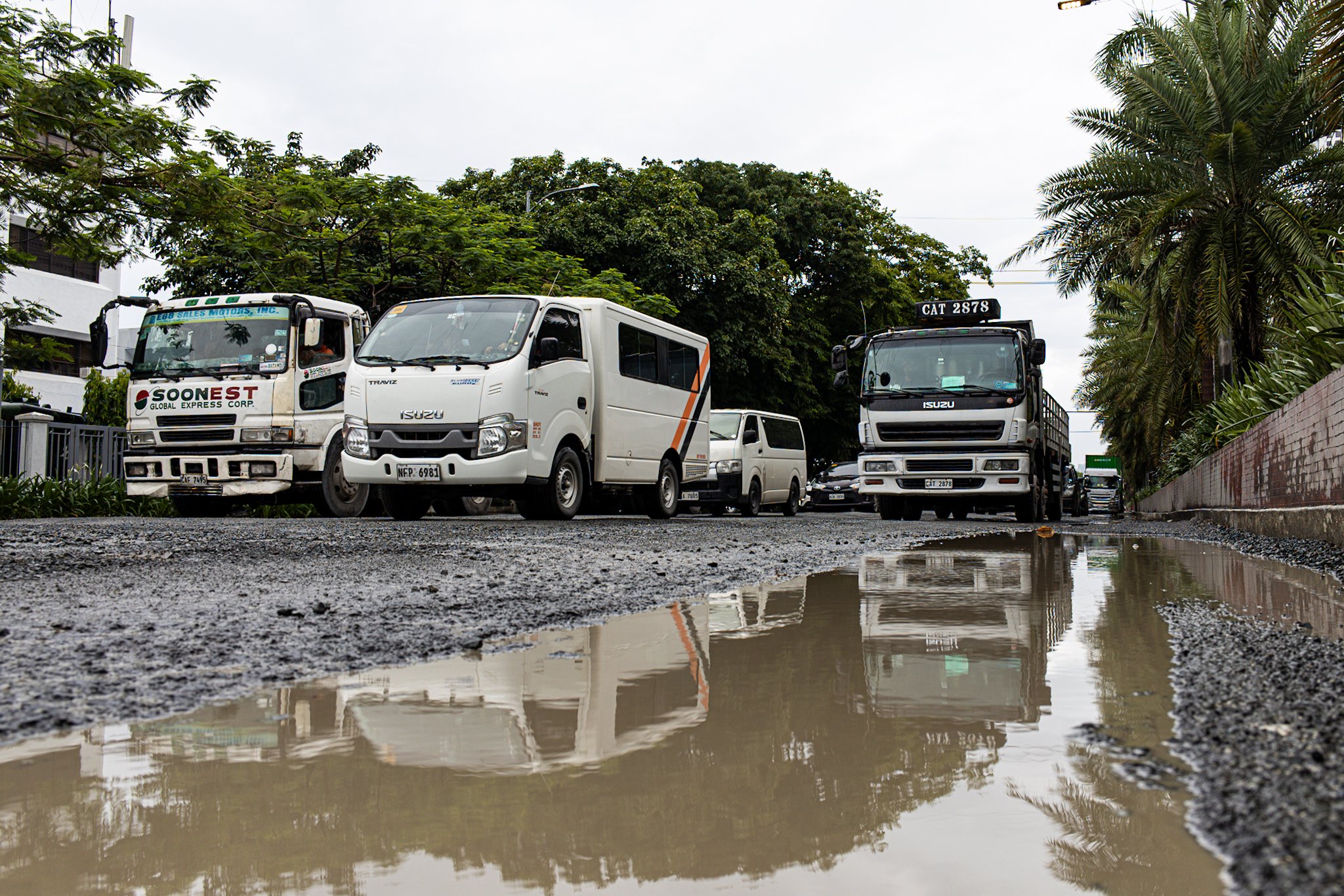 Damaged roads cause sluggish traffic along Roxas Blvd in Pasay City on Saturday, 26 July 2025, following heavy rains brought by the habagat and the back-to-back-to-back typhoons.