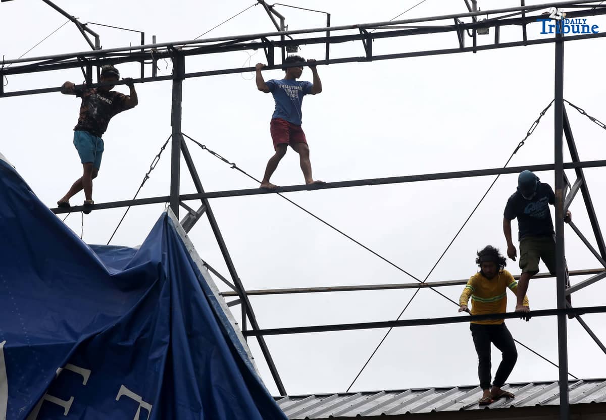 Workers were seen untying an outdoor advertisement along Commonwealth Avenue in Quezon City on Saturday morning. In a briefing past 5 AM, the Philippine Atmospheric, Geophysical, and Astronomical Services Administration (PAGASA) reported that Tropical Storm Emong (Co-may) weakened into a tropical depression as of 2 AM and exited the Philippine Area of Responsibility (PAR) at 7:10 AM.