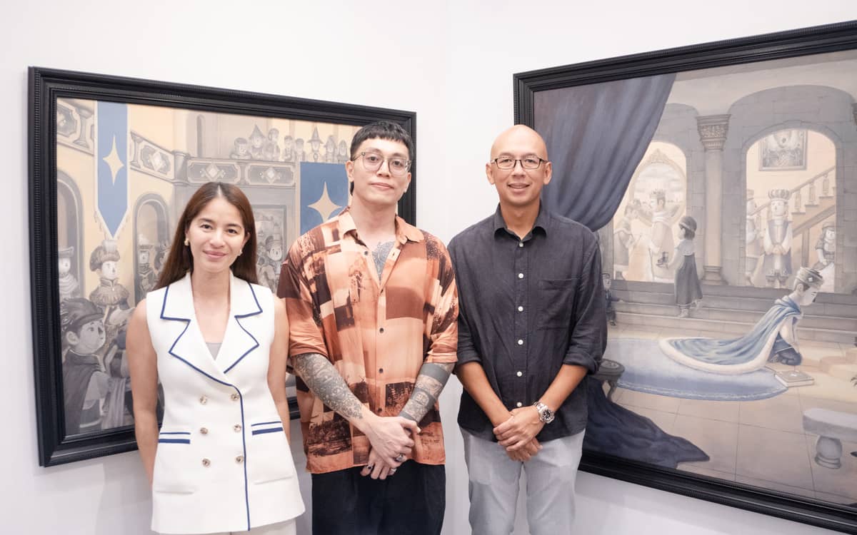 Village Art Gallery's Sam and Anton Lorenzo with artist Qwark in the middle.