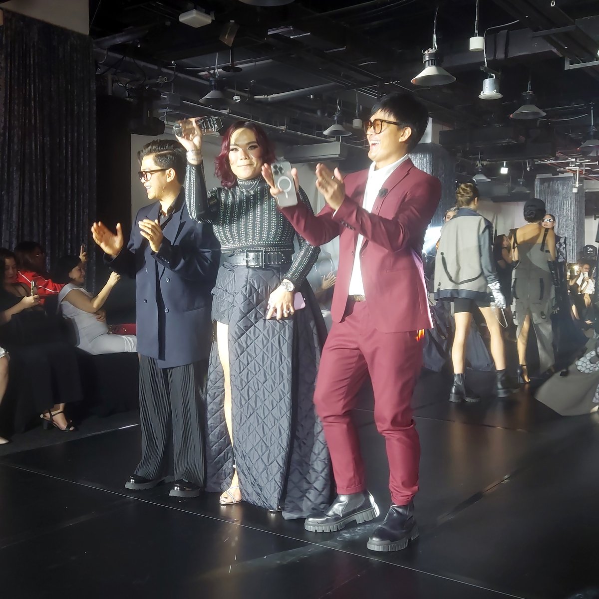 CIFAW officials Limuel Vilela and Alvin Masangkay Francia with designer Maliyah Abenir at the center.