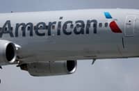 AN American Airlines plane lands at the Miami International Airport on July 24, 2025 in Miami, Florida. American Airlines issued a cautious forecast for the third quarter and narrowed its full-year guidance, due to ongoing uncertainty in travel demand.