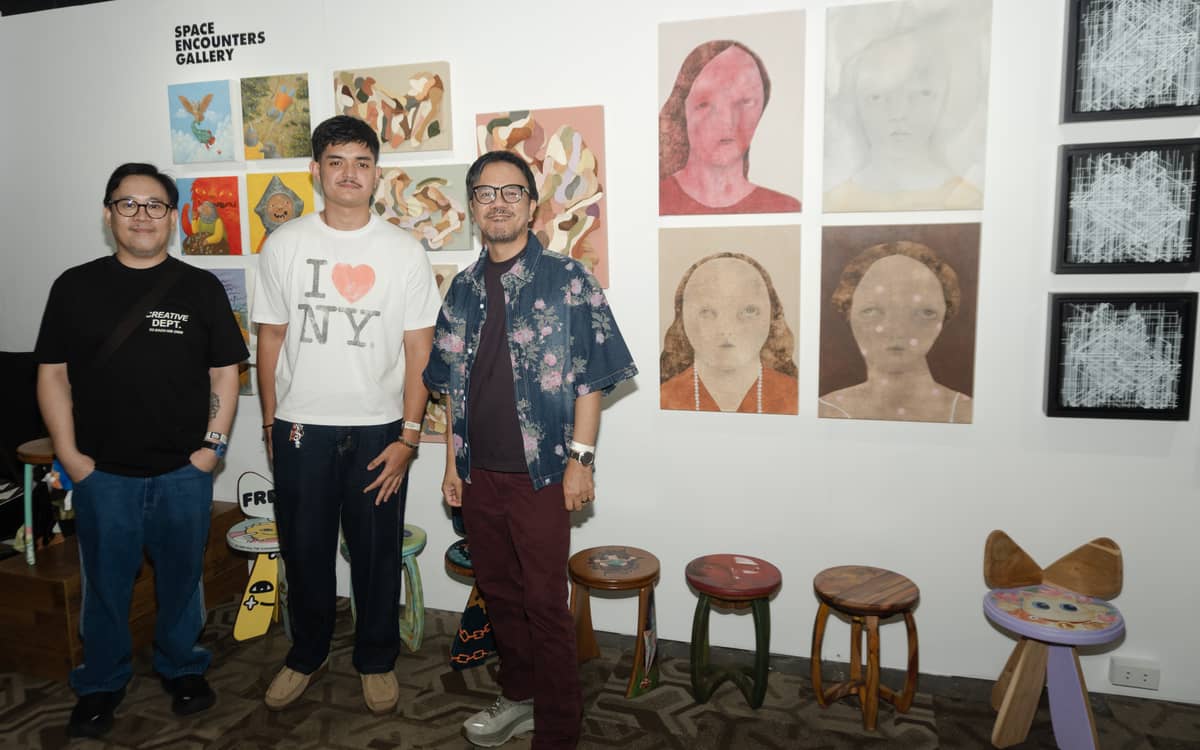 Space Encounters Gallery's Thor Balanon and Wilmer Lopez with artist Marco Padayao (center).