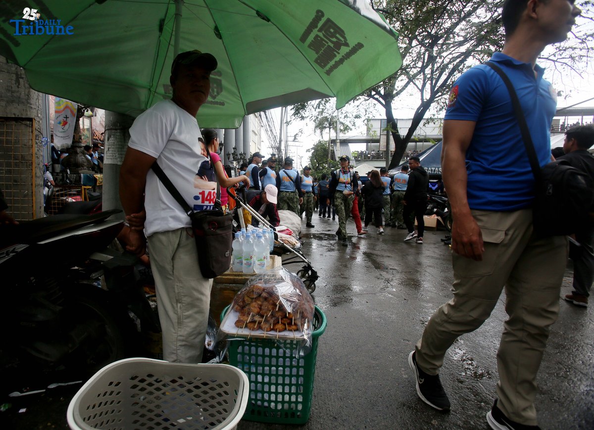 A vendor sells food and water outside St. Peter Church in Quezon City during the fourth State of the Nation Address of President Ferdinand Marcos Jr. on Monday, July 28, 2025.