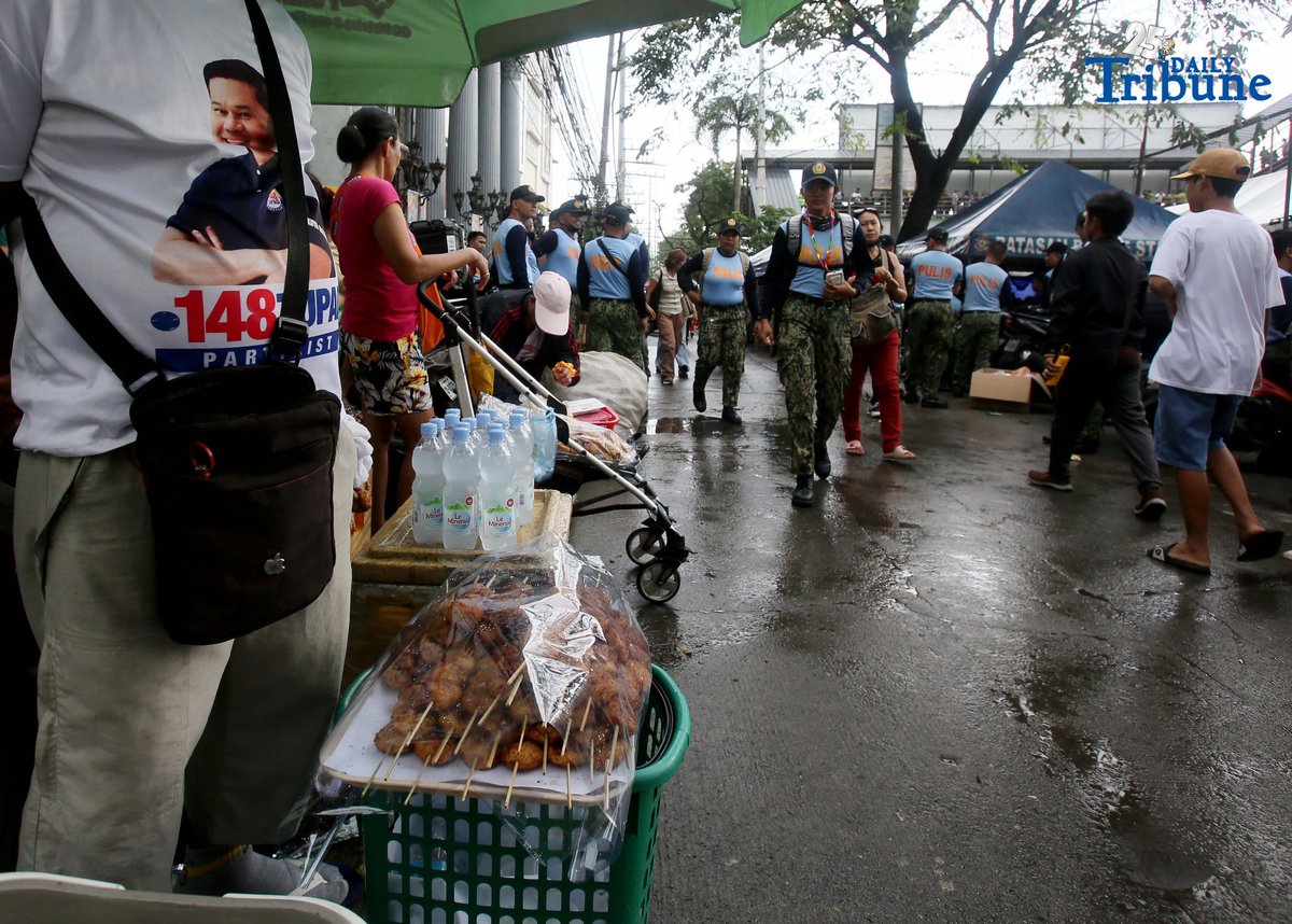 A vendor sells food and water outside St. Peter Church in Quezon City during the fourth State of the Nation Address of President Ferdinand Marcos Jr. on Monday, July 28, 2025.