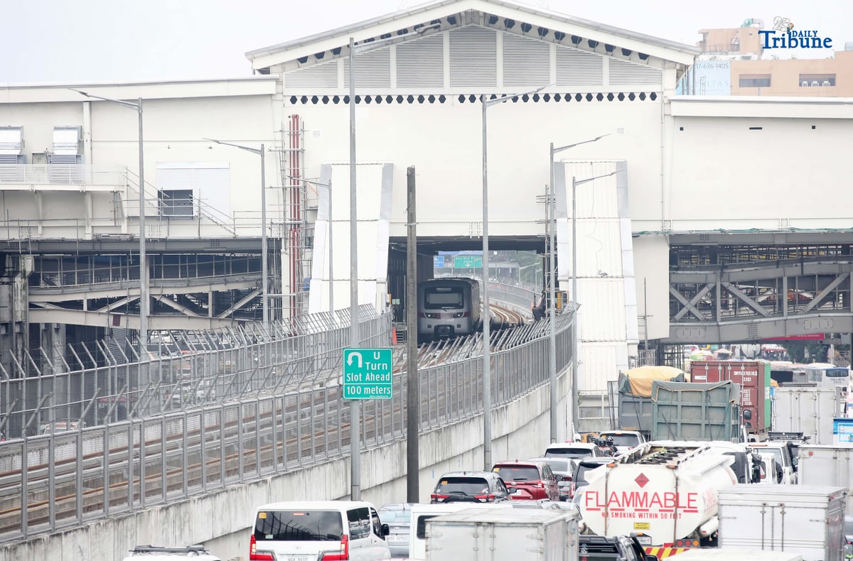 A Metro Rail Transit Line 7 (MRT-7) train is seen parked at Don Antonio Station along Commonwealth Avenue in Quezon City on Monday, July 28, 2025. The 22-kilometer elevated railway connecting Metro Manila to Bulacan via Commonwealth Avenue is expected to begin trial runs by the end of 2025, according to operator San Miguel Corporation.
