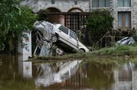 A DAMAGED car is seen in a flooded neighbourhood in Miyun district, on the outskirts of Beijing on July 29, 2025. Heavy rain in Beijing killed 30 people and forced authorities to evacuate tens of thousands as swathes of northern China were lashed by torrential downpours that sparked deadly landslides, state media said on July 29.