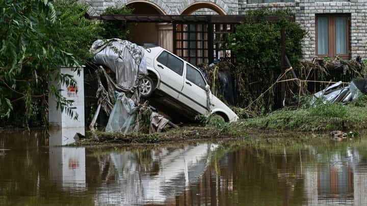 A DAMAGED car is seen in a flooded neighbourhood in Miyun district, on the outskirts of Beijing on July 29, 2025. Heavy rain in Beijing killed 30 people and forced authorities to evacuate tens of thousands as swathes of northern China were lashed by torrential downpours that sparked deadly landslides, state media said on July 29.