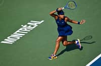 Naomi Osaka of Japan plays a forehand against Ariana Arseneault of Canada during their first round match on Day Two of the WTA 1000 National Bank Open at IGA Stadium on July 28, 2025 in Montreal, Quebec, Canada.