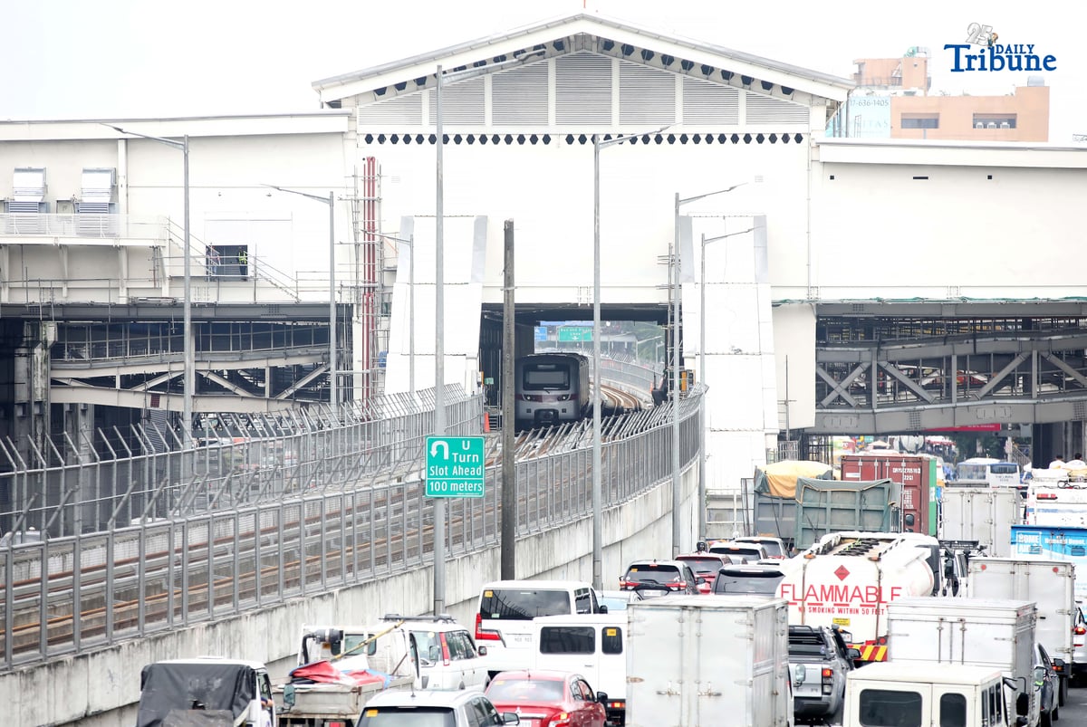 A Metro Rail Transit Line 7 (MRT-7) train is seen parked at Don Antonio Station along Commonwealth Avenue in Quezon City on Monday, July 28, 2025. The 22-kilometer elevated railway connecting Metro Manila to Bulacan via Commonwealth Avenue is expected to begin trial runs by the end of 2025, according to operator San Miguel Corporation.