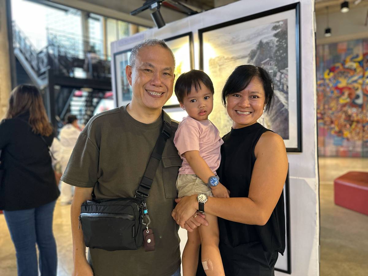 Jon and Dadai Joaquin with their grandson Theo.
