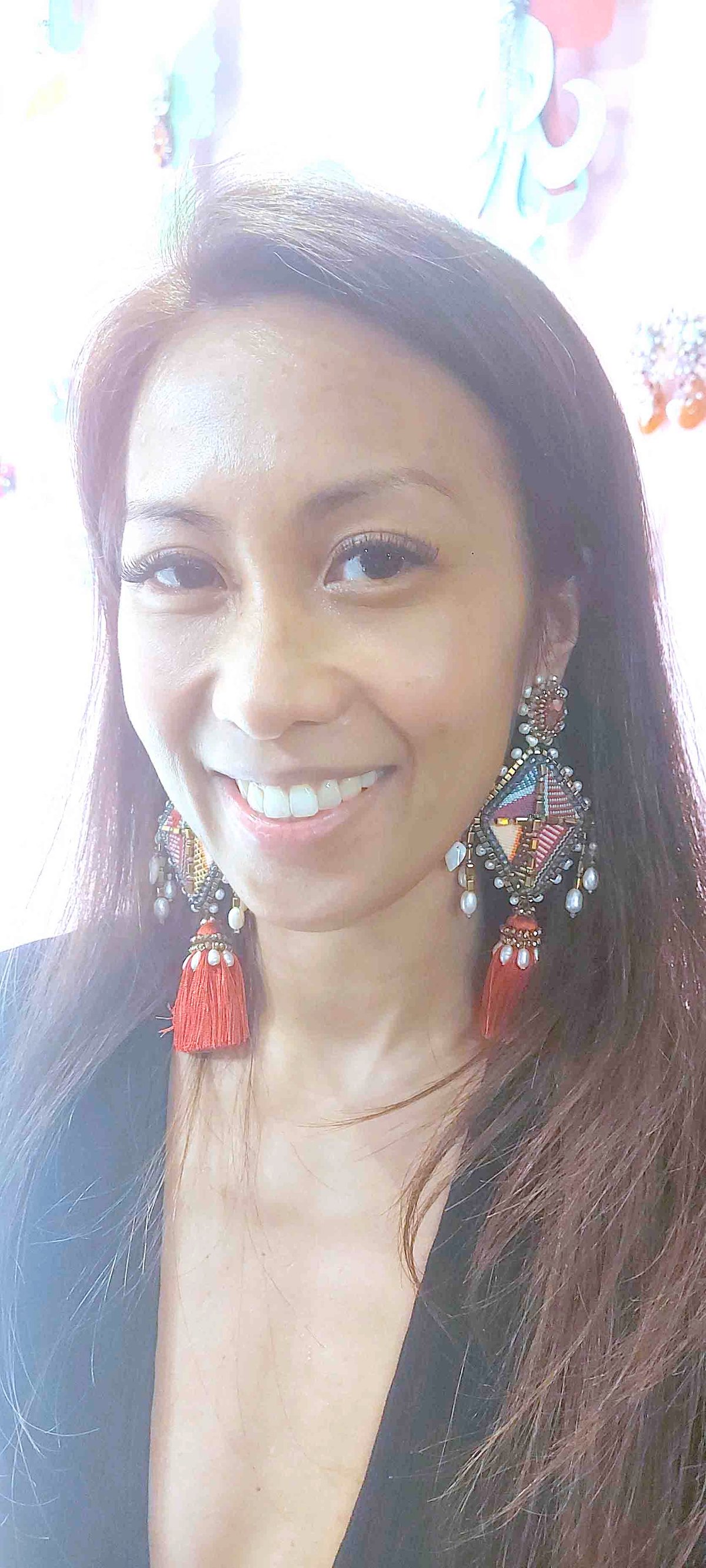 Designer Farah Abu wearing her saranggola or kite earrings.