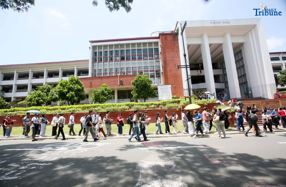 (August 02 2025) University of the Philippines college admission test UPCAT examinees queue to enter Palma Hall to take  admission test at University of the Philippines in Diliman Quezon City on Saturday August 2 2025, UPCAT is part of the admission requirements for the University of the Philippines System and is administered to Filipino and foreign high school graduates. Photo/Analy Labor