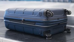 Woman arrested for traveling with child in suitcase