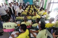COMMISSION on Elections chairperson George Garcia checks on the poll registration undertaken Monday for persons deprived of liberty at the Manila City Jail.