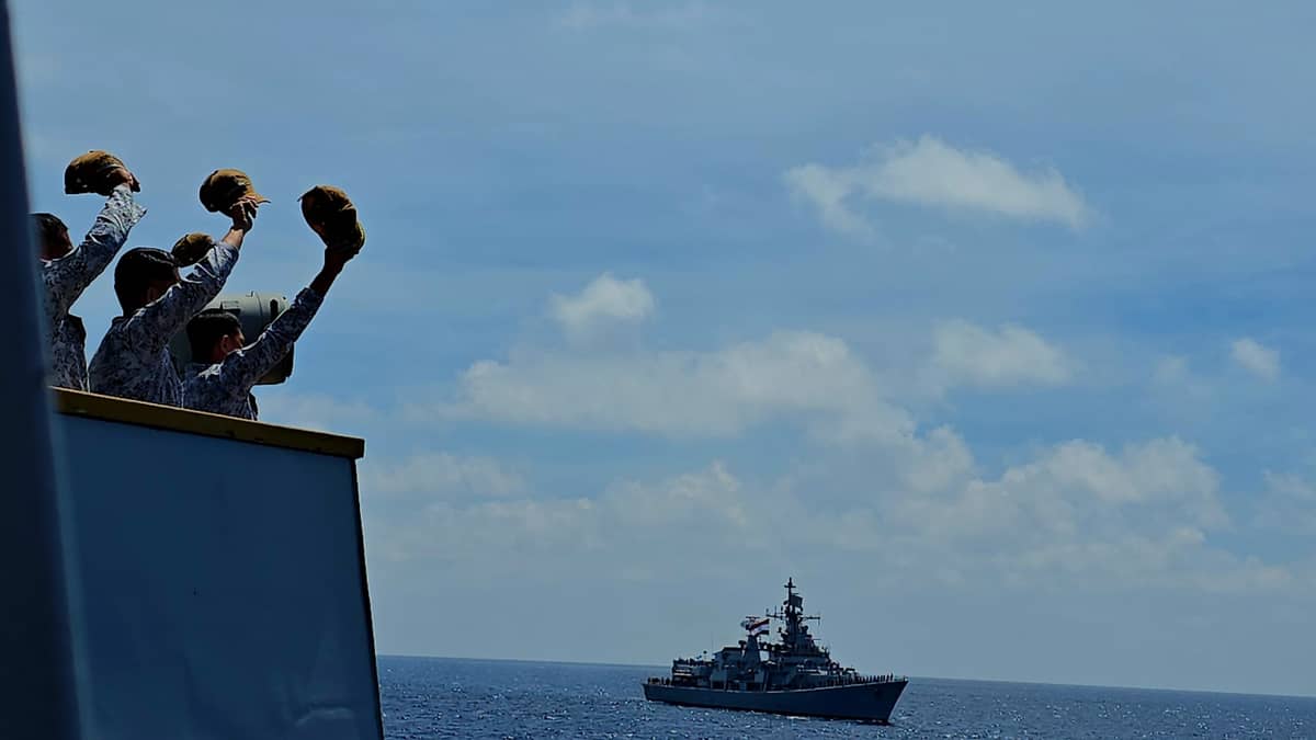 Caption: Philippine Navy crew aboard the BRP Jose Rizal (FF160) are Indian Navy personnel aboard the INS Delhi (D61) waving to during the passing exercise on Monday, August 4, 2025. This is part of the first-ever Maritime Cooperative Activity (MCA) between the Philippine and Indian military held in the vicinity of the West Philippine Sea. (Photo by Lade Kabagani )