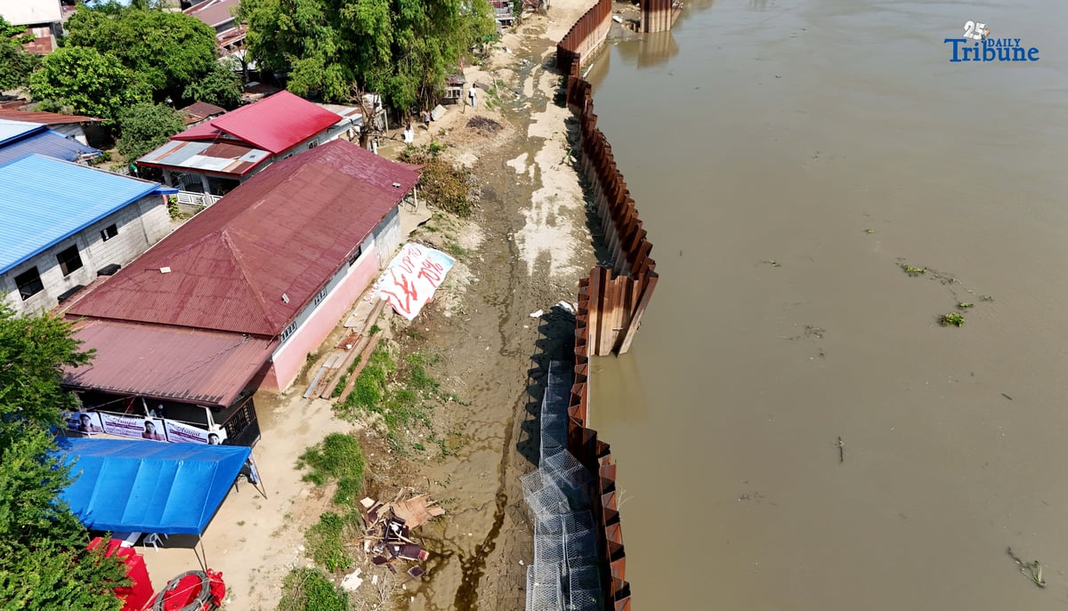 Department of Budget and Management (DBM) Secretary Amenah F. Pangandaman inspects the ongoing P91.4-million flood control project in Brgy. Candating, Arayat, Pampanga, which collapsed on August 17, 2024