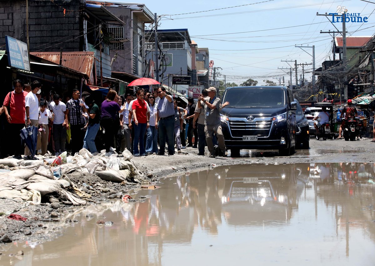 Department of Budget and Management (DBM) Secretary Amenah F. Pangandaman, Apalit Mayor Jun Tetangco, and DPWH officials inspect the flooded portion of the Apalit-Macabebe Road from Colgante to Sampaga, San Vicente. Mayor Tetangco appealed to Secretary Pangandaman for assistance in completing the unfinished infrastructure project.