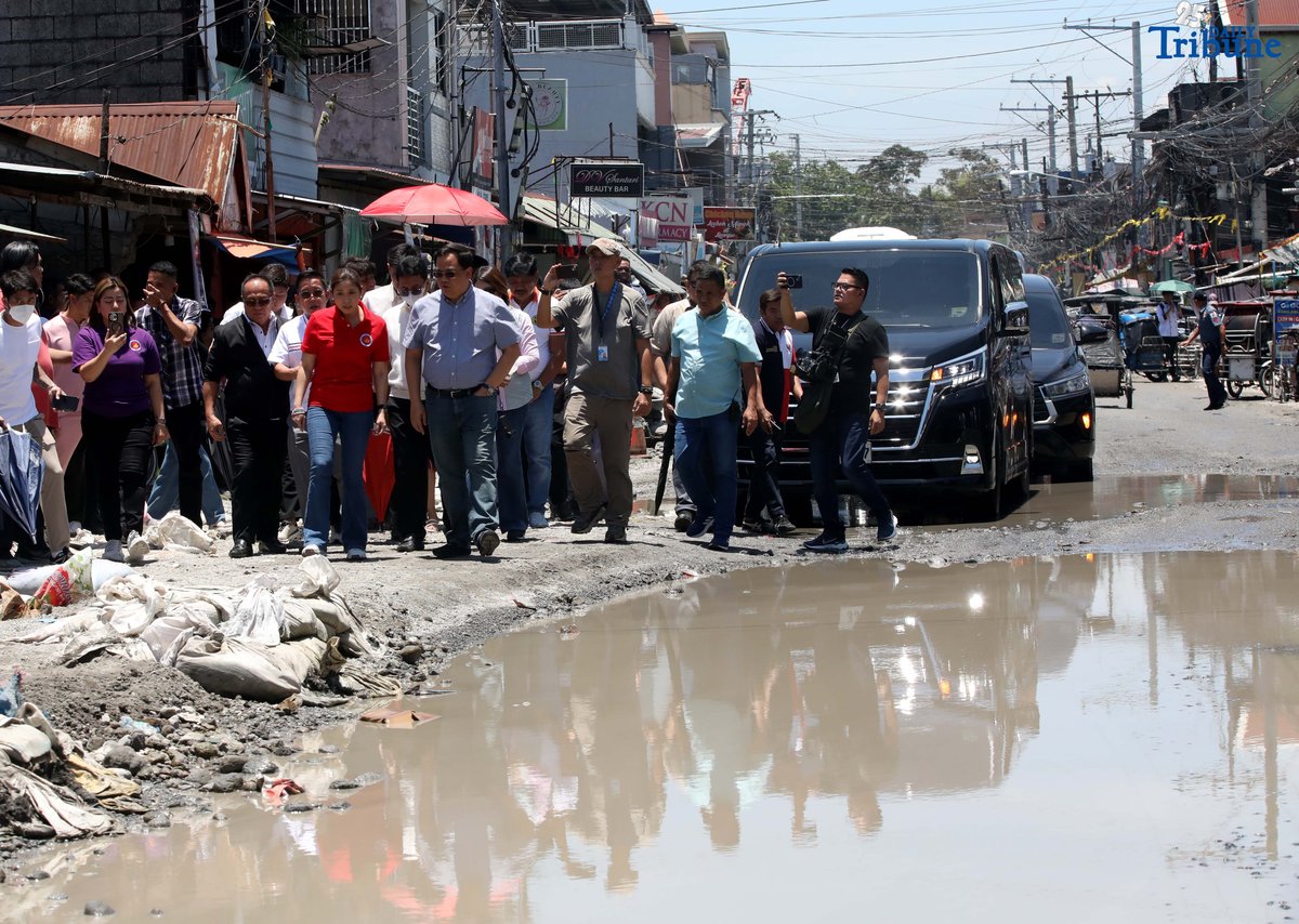 Department of Budget and Management (DBM) Secretary Amenah F. Pangandaman, Apalit Mayor Jun Tetangco, and DPWH officials inspect the flooded portion of the Apalit-Macabebe Road from Colgante to Sampaga, San Vicente. Mayor Tetangco appealed to Secretary Pangandaman for assistance in completing the unfinished infrastructure project.