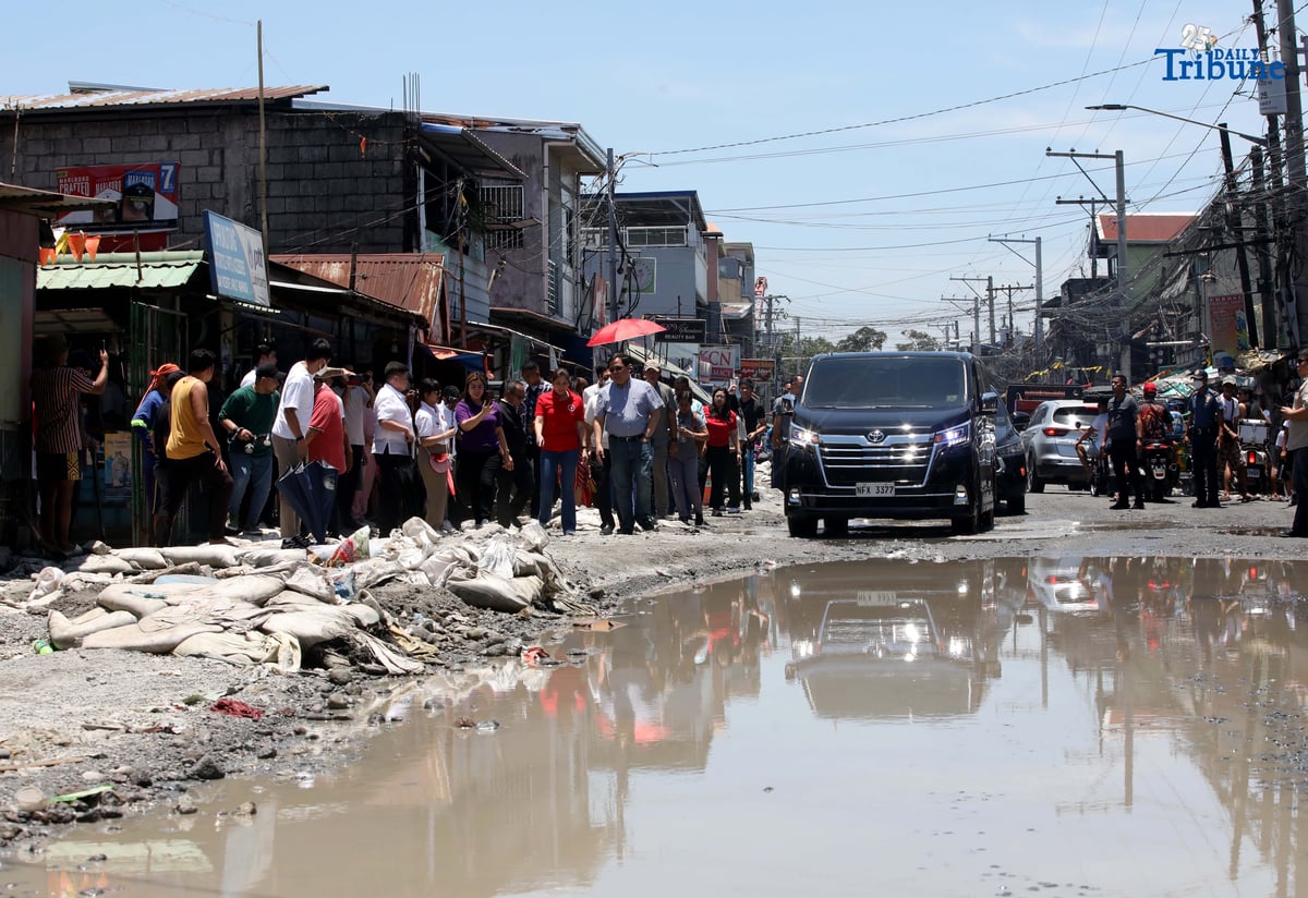 Department of Budget and Management (DBM) Secretary Amenah F. Pangandaman, Apalit Mayor Jun Tetangco, and DPWH officials inspect the flooded portion of the Apalit-Macabebe Road from Colgante to Sampaga, San Vicente. Mayor Tetangco appealed to Secretary Pangandaman for assistance in completing the unfinished infrastructure project.