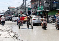 Improvised bike braves Pampanga floodwaters