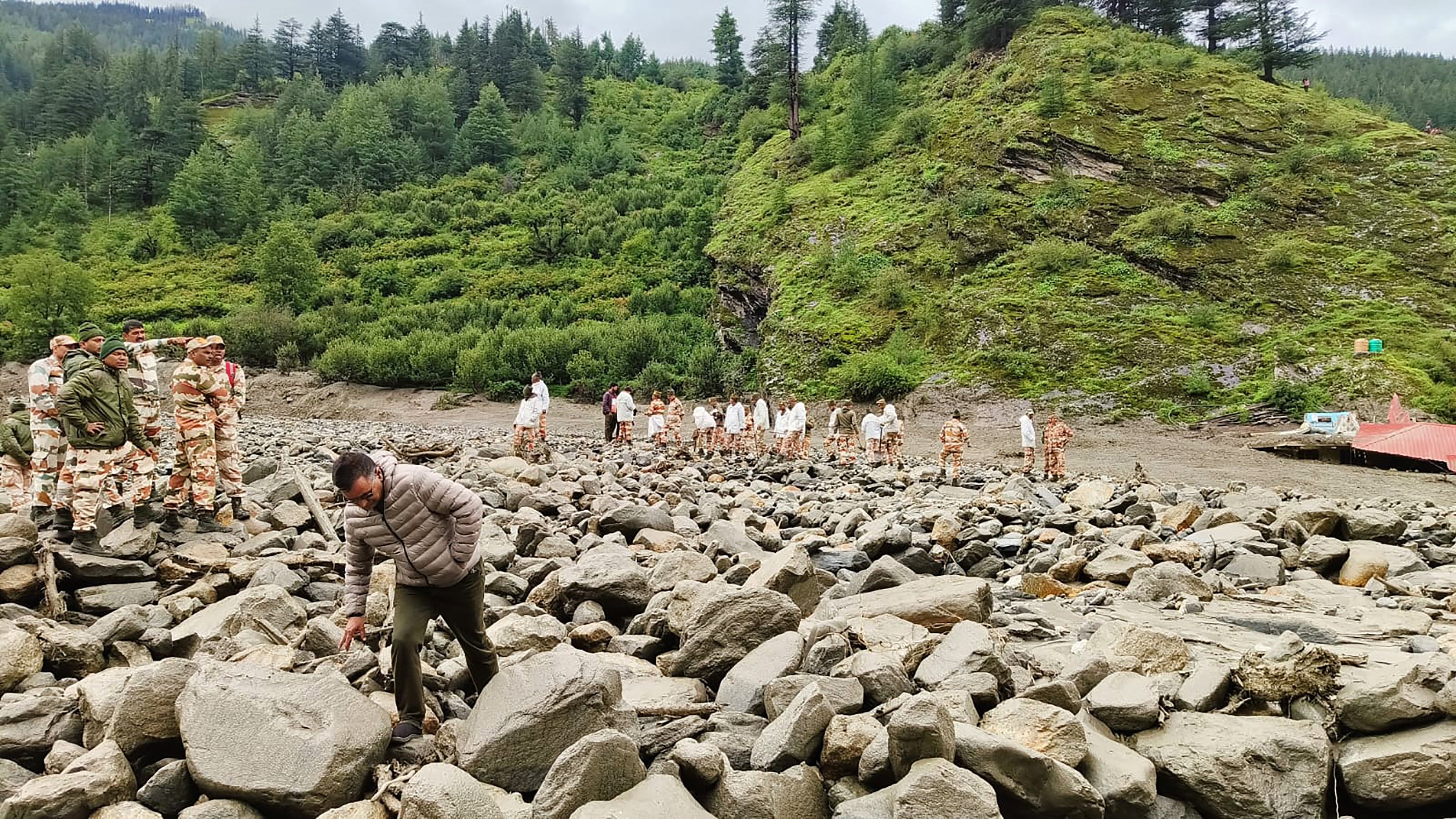 Soldiers search for missing after flood swamps town