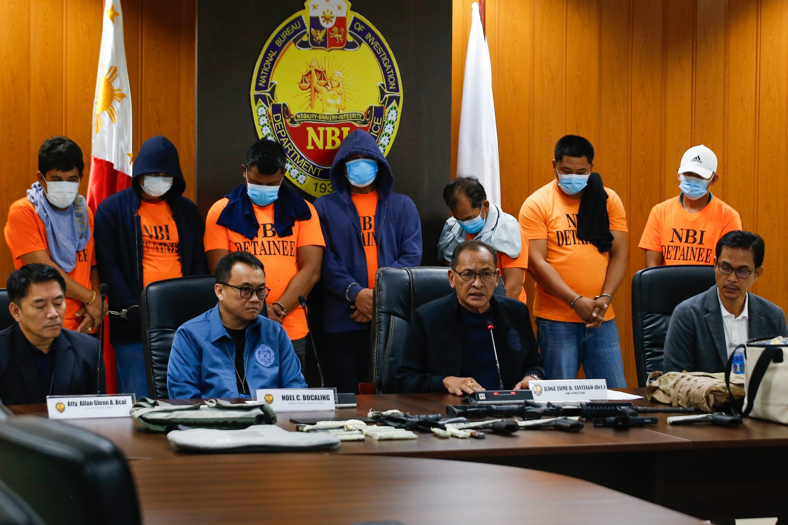 San Simon Mayor Abundio Punsalan Jr., along with his security detail, is presented by the National Bureau of Investigation in Pasay City on 7 August 2025. They were arrested Tuesday night in an entrapment operation over allegations of extortion. The mayor allegedly accepted an initial bribe of ₱30 million in exchange for a favorable local government resolution.