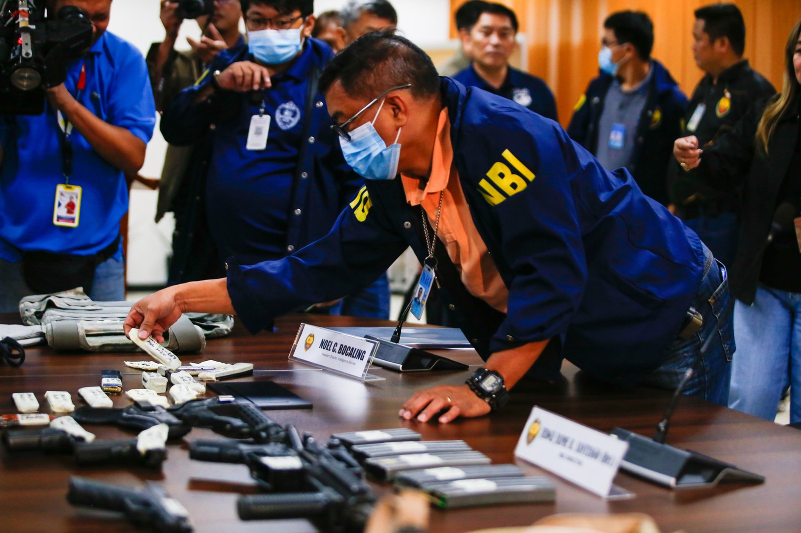 San Simon Mayor Abundio Punsalan Jr., along with his security detail, is presented by the National Bureau of Investigation in Pasay City on 7 August 2025. They were arrested Tuesday night in an entrapment operation over allegations of extortion. The mayor allegedly accepted an initial bribe of ₱30 million in exchange for a favorable local government resolution.
