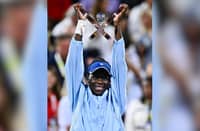 Victoria Mboko proudly raises the WTA Canadian Open trophy after topping Naomi Osaka, 2-6, 6-4, 6-1, in Montreal.