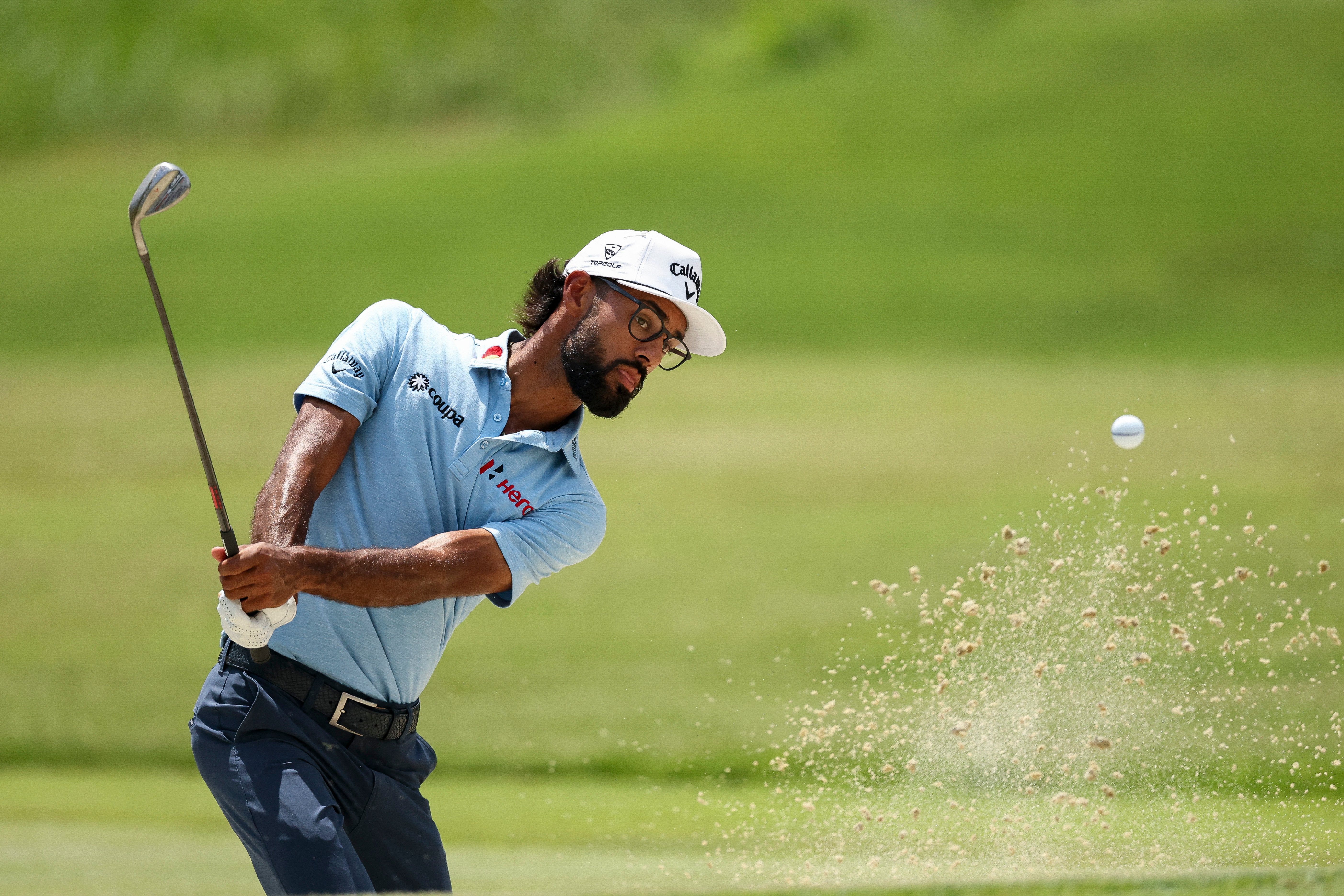 Bhatia finishes strong for lead