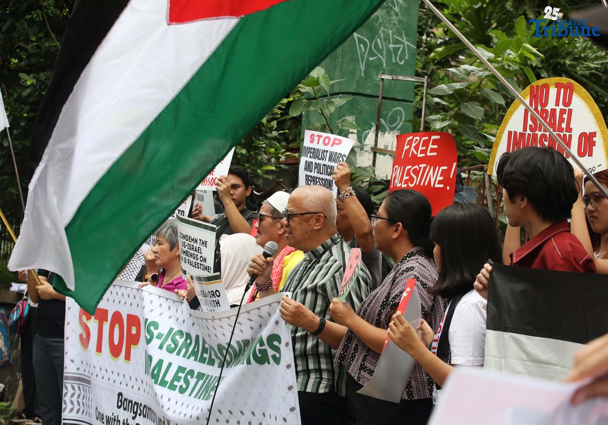 Members of a militant group and the Philippine-Palestine Friendship Association hold an indignation rally at the corner of E. Rodriguez Avenue and Gilmore Street in Quezon City on Saturday to protest Israel’s planned ground invasion of Gaza. The demonstrators condemned the move as part of what they described as Israel’s ongoing genocidal campaign, citing the rising civilian death toll and worsening humanitarian crisis in the besieged Palestinian territory.