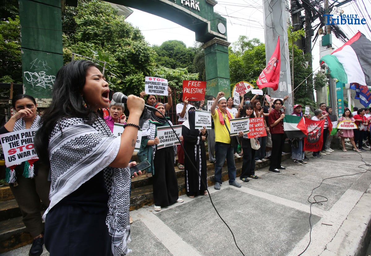 Members of a militant group and the Philippine-Palestine Friendship Association hold an indignation rally at the corner of E. Rodriguez Avenue and Gilmore Street in Quezon City on Saturday to protest Israel’s planned ground invasion of Gaza. The demonstrators condemned the move as part of what they described as Israel’s ongoing genocidal campaign, citing the rising civilian death toll and worsening humanitarian crisis in the besieged Palestinian territory.