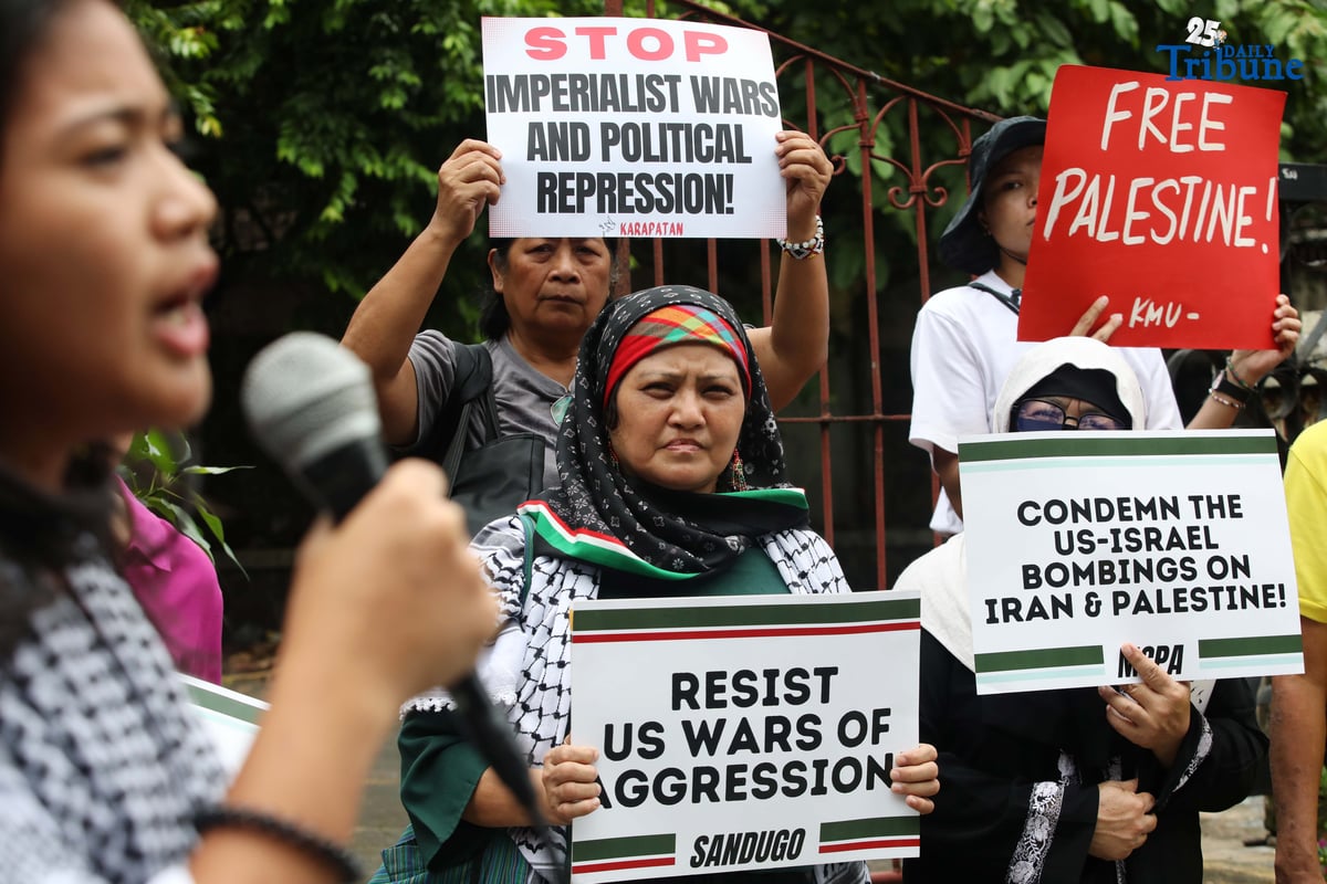 Members of a militant group and the Philippine-Palestine Friendship Association hold an indignation rally at the corner of E. Rodriguez Avenue and Gilmore Street in Quezon City on Saturday to protest Israel’s planned ground invasion of Gaza. The demonstrators condemned the move as part of what they described as Israel’s ongoing genocidal campaign, citing the rising civilian death toll and worsening humanitarian crisis in the besieged Palestinian territory.