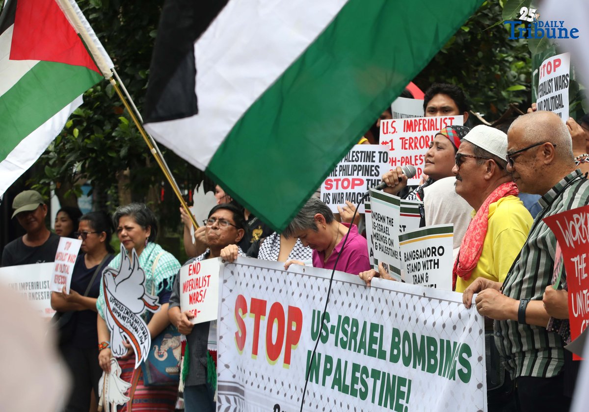 Members of a militant group and the Philippine-Palestine Friendship Association hold an indignation rally at the corner of E. Rodriguez Avenue and Gilmore Street in Quezon City on Saturday to protest Israel’s planned ground invasion of Gaza. The demonstrators condemned the move as part of what they described as Israel’s ongoing genocidal campaign, citing the rising civilian death toll and worsening humanitarian crisis in the besieged Palestinian territory.
