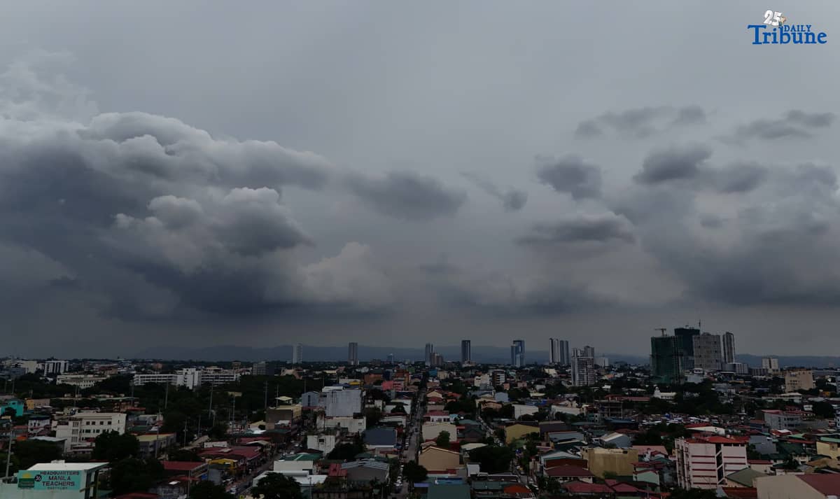 Dark clouds blanket Metro Manila’s skyline, as seen from Quezon City on Saturday, ahead of the possible entry of Severe Tropical Storm Pudol into the Philippine Area of Responsibility by Sunday evening or Monday afternoon, according to PAGASA.