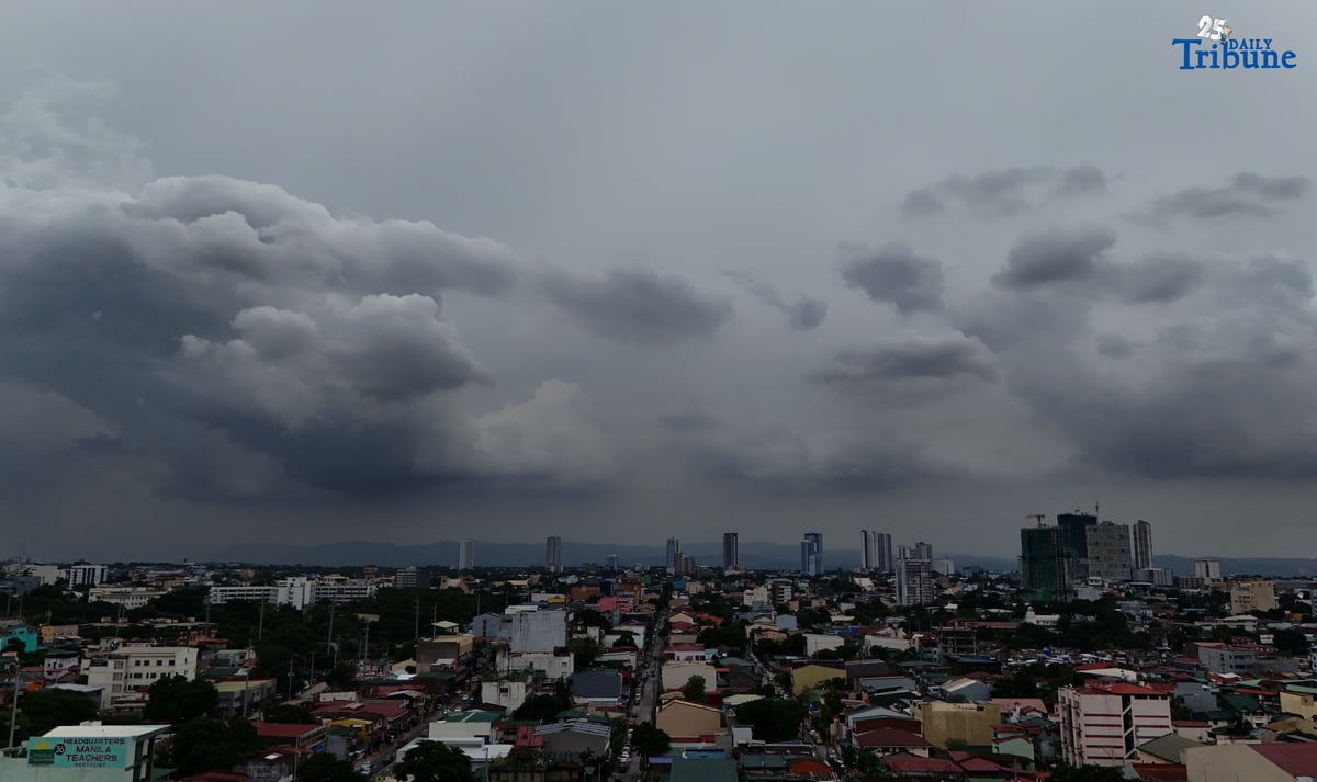 Dark clouds blanket Metro Manila’s skyline, as seen from Quezon City on Saturday, ahead of the possible entry of Severe Tropical Storm Pudol into the Philippine Area of Responsibility by Sunday evening or Monday afternoon, according to PAGASA.