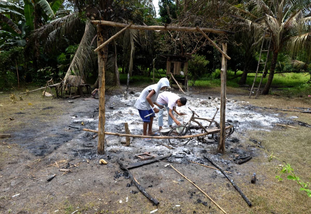 Armed conflict is a key hurdle for the youth to develop their potential. Children salvage belongings from the ruins of their home in the village of Takepan, North Cotabato province after an attack by rebels.