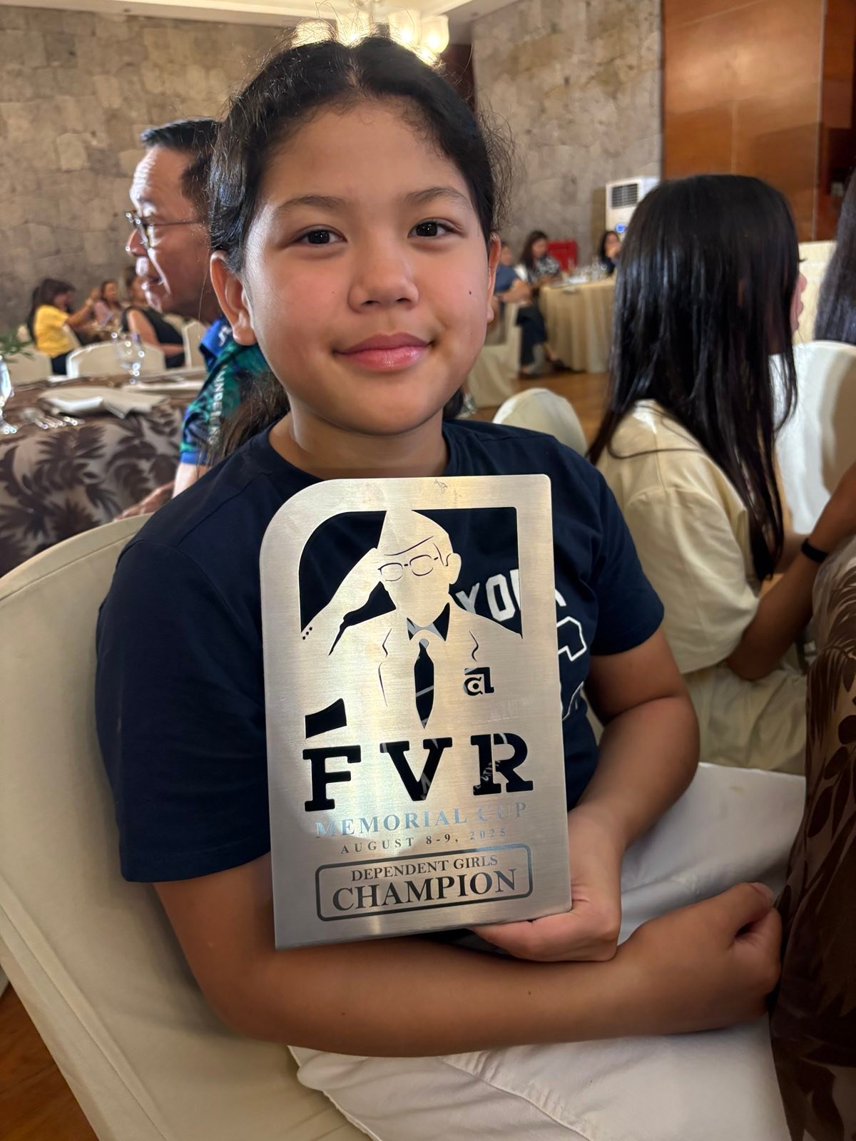 SHANTELLE Laurel smiles as she displays one of the first fruits of her hard work and sacrifices: A plaque from the FVR Memorial Cup over the weekend.