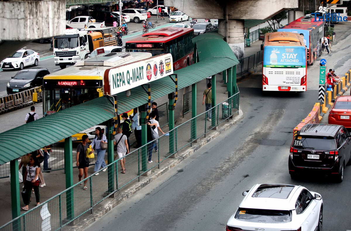 Passengers wait at the Nepa Q-Mart Bus Station in Quezon City on August 11, 2025. Transportation Secretary Jaime Bautista said in an interview that the busway rehabilitation project is now underway