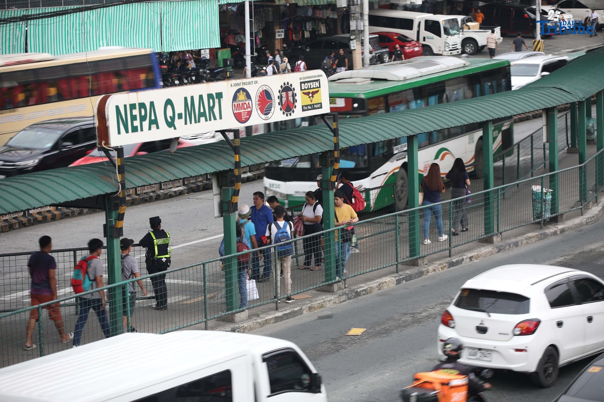 Passengers wait at the Nepa Q-Mart Bus Station in Quezon City on August 11, 2025. Transportation Secretary Jaime Bautista said in an interview that the busway rehabilitation project is now underway