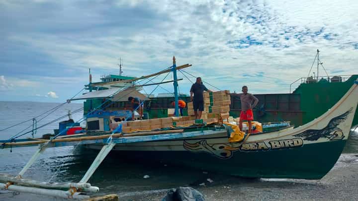 The crew from the motorized fishing vessel that was intercepted by members of the Western Mindanao Naval Command for carrying P16.4 million worth of smuggled cigarettes in the waters of Basilan are waiting for orders to unload the contraband.
