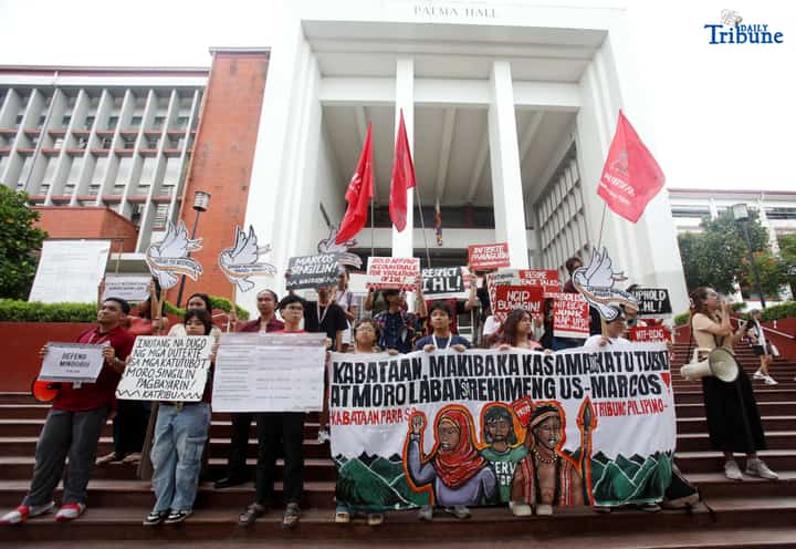 Members of the IP group Katribu stage a protest in front of Palma Hall at UP Diliman, Quezon City, on Tuesday, August 12, 2025, to mark the International Day of the World’s Indigenous Peoples.
