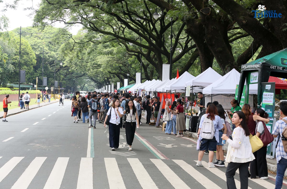 On the second day of school, students visit different organizations during the University of the Philippines Freshie Month Org Fair in front of Palma Hall at the UP Diliman campus in Quezon City on Tuesday, August 12, 2025.