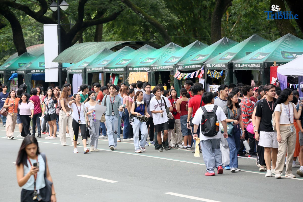 On the second day of school, students visit different organizations during the University of the Philippines Freshie Month Org Fair in front of Palma Hall at the UP Diliman campus in Quezon City on Tuesday, August 12, 2025.
