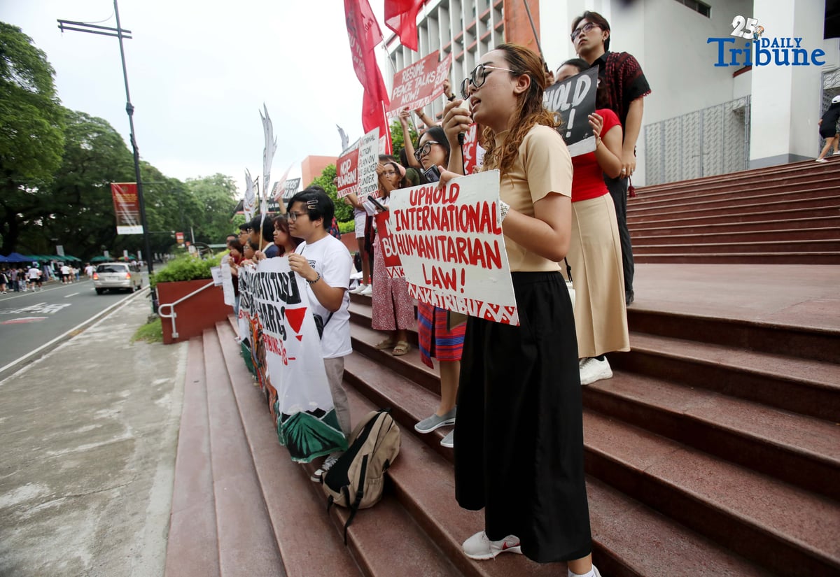 Members of the IP group Katribu stage a protest in front of Palma Hall at UP Diliman, Quezon City, on Tuesday, August 12, 2025, to mark the International Day of the World’s Indigenous Peoples.